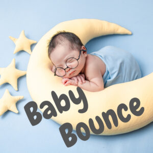 Blue square with a swaddled infant, wearing glasses, swaddled, and resting on moon and star shaped pillows.
