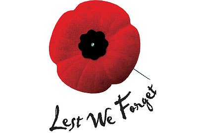 Red Remembrance Day poppy with text, Lest We Forget.